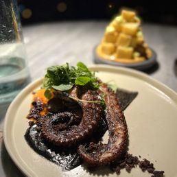 MDRD Restaurant signature dishes Pulpo a la Gallega (grilled octopus), Patatas Bravas, Vieiras con Maiz (seared scallops), Chuleta Iberíco (Iberian bone-in pork chop)